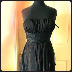 Ankle length dress with horizontal ruffles.